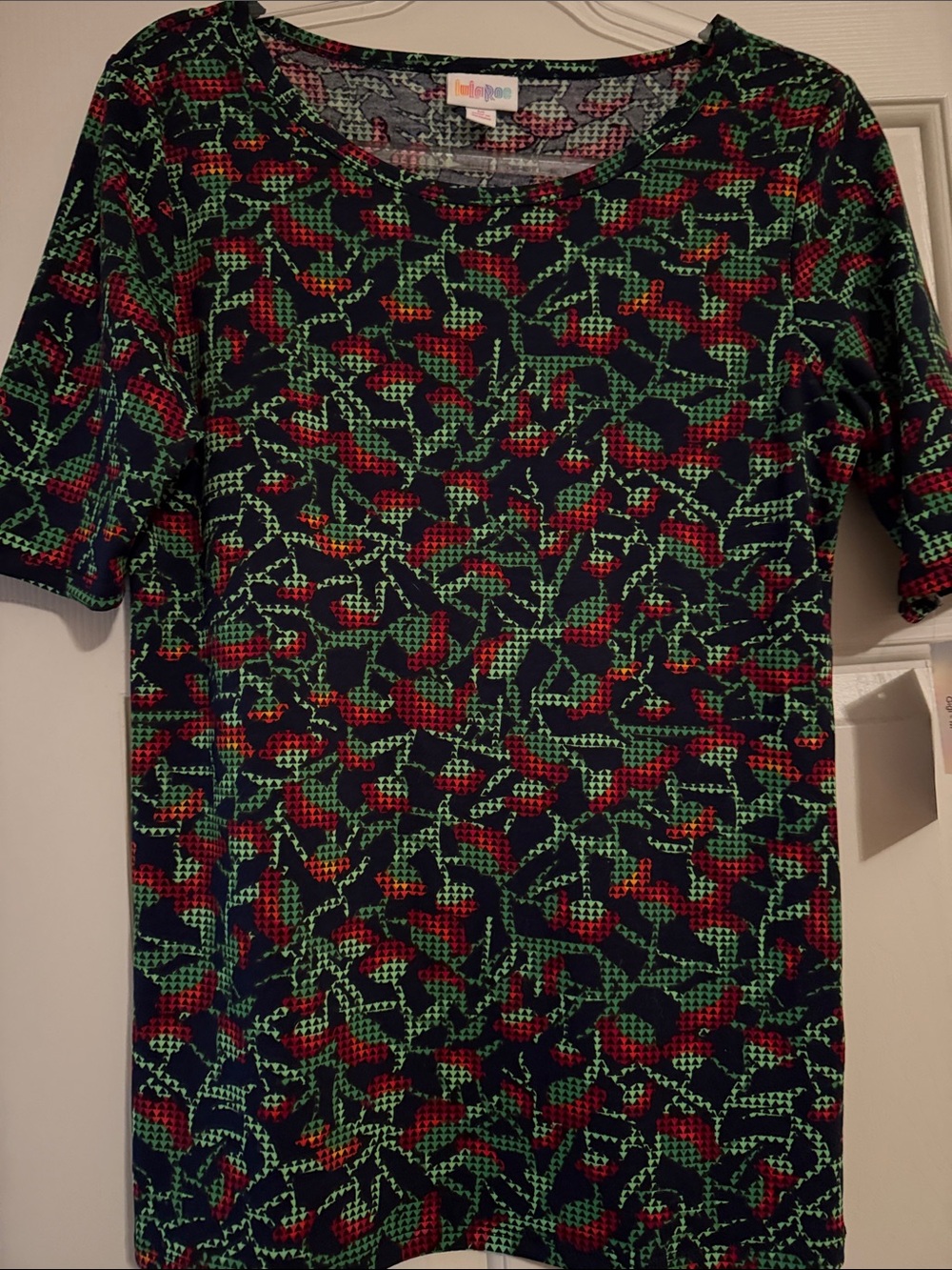 LuLaRoe Navy Top with Red & Green Abstract Print